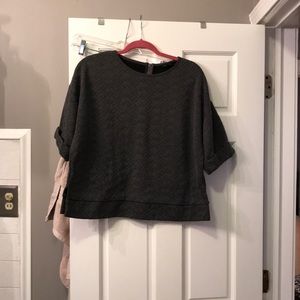 Gray quilted cropped top with exposed zipper